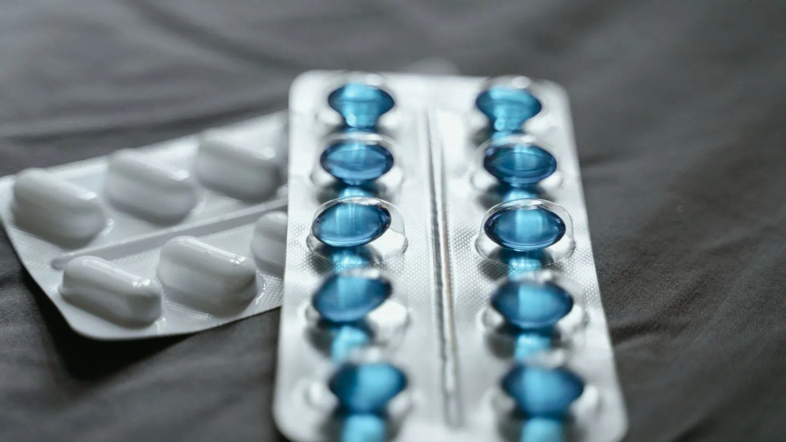 Blister packs of blue and white pills